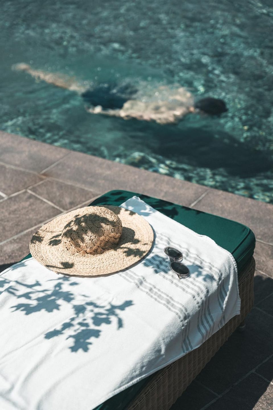 Swimming pool, sunbed, towels