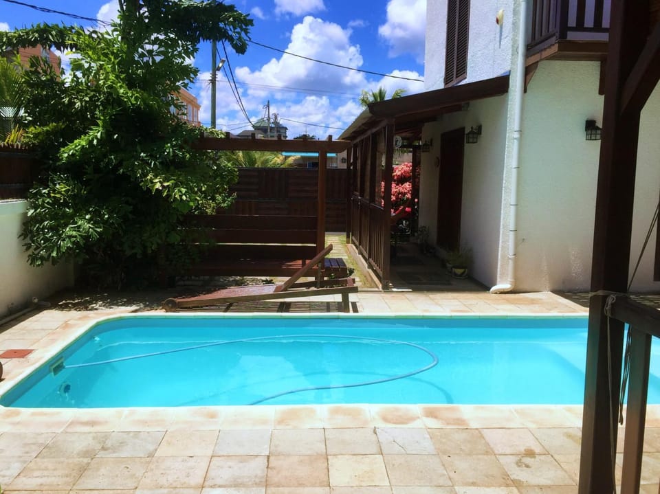 Property building, Patio, Day, Pool view, Swimming pool, sunbed