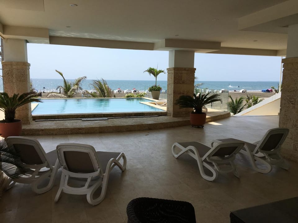 Property building, Patio, Lobby or reception, Swimming pool