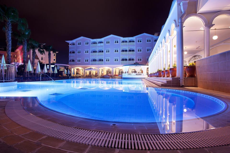 Property building, Night, Swimming pool, Swimming pool, sunbed