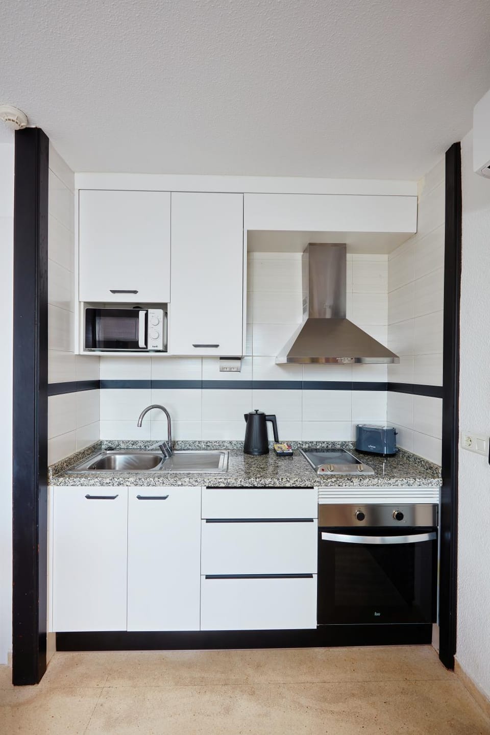Kitchen or kitchenette, microwave, oven, stove, toaster, kitchen