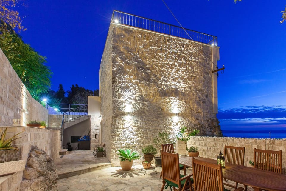 Property building, Patio, Night, Natural landscape, BBQ facilities, Sea view, Dinner