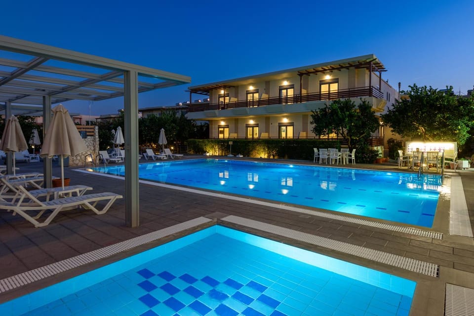Property building, Night, View (from property/room), View (from property/room), Pool view, Pool view, Swimming pool, sunbed