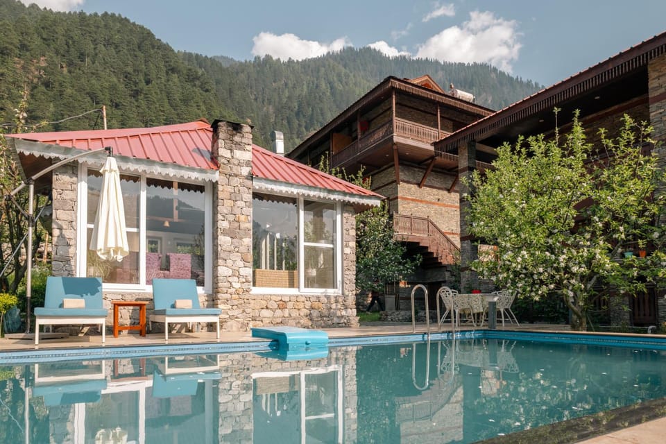 Property building, Facade/entrance, Spring, Day, Natural landscape, Mountain view, Pool view, Swimming pool, sunbed