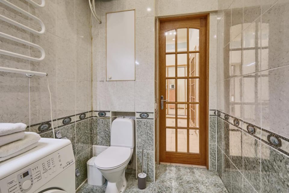 Toilet, towels, washing machine, dryer