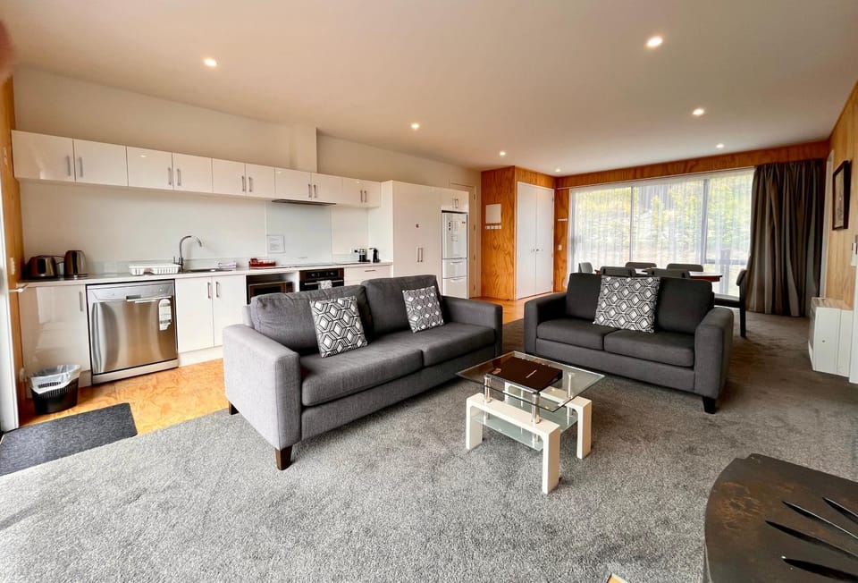 Living room, Seating area, dishwasher, oven, stove, washing machine, kitchen