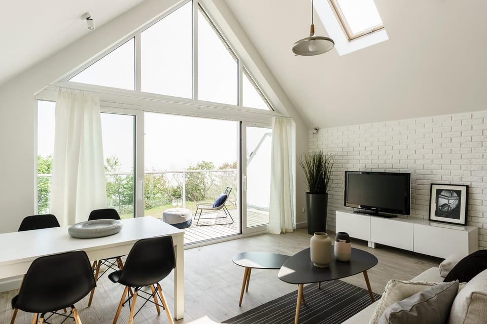 Property building, Living room, Seating area, Dining area, Sea view