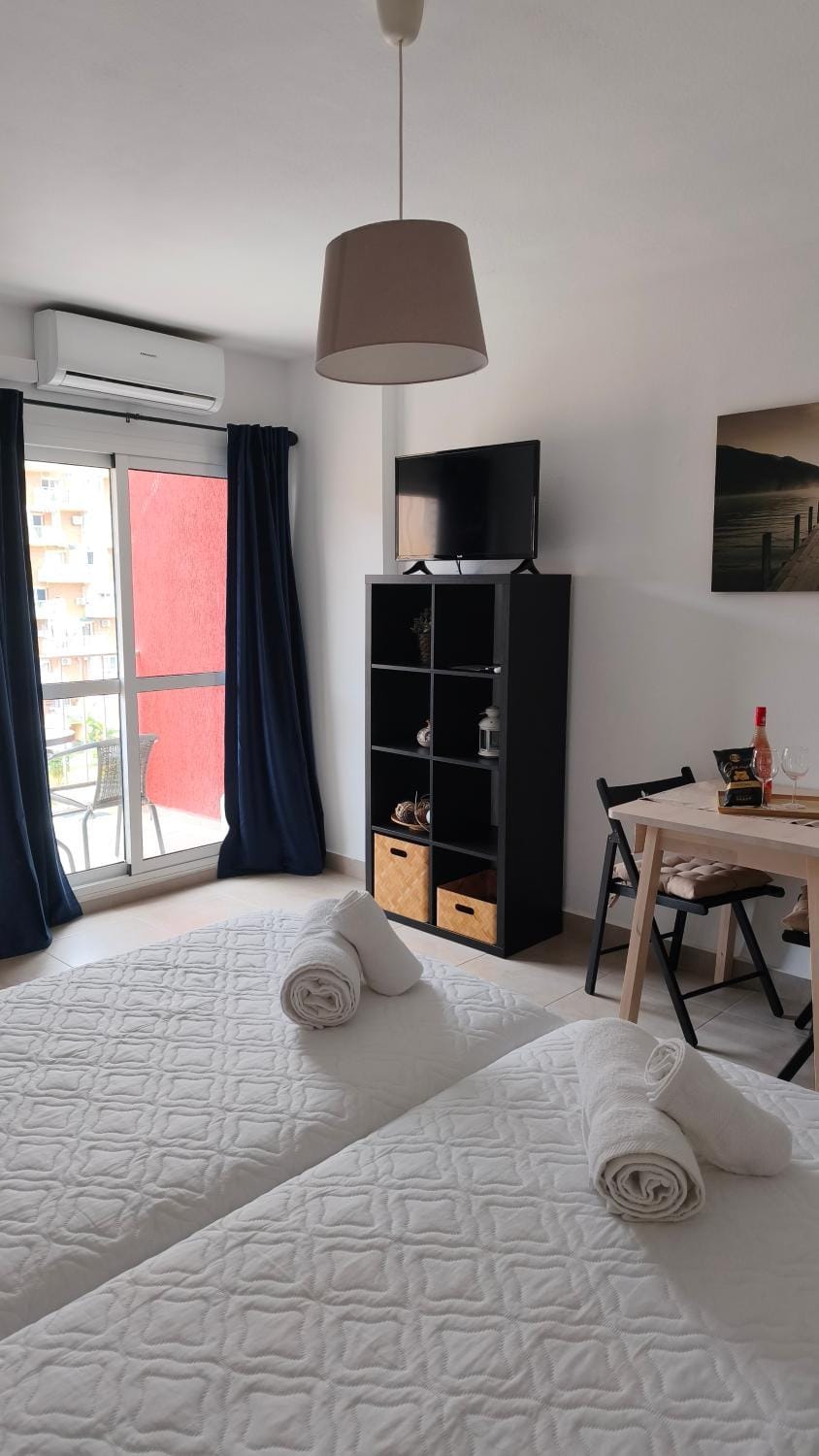Bed, TV and multimedia, Living room, Seating area, Bedroom