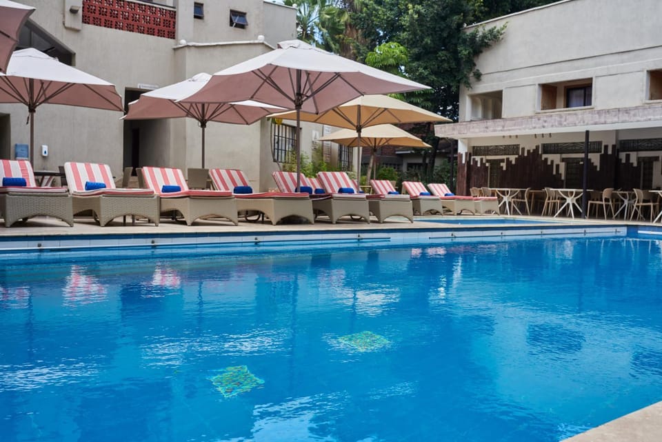 Property building, Day, Pool view, Swimming pool, sunbed