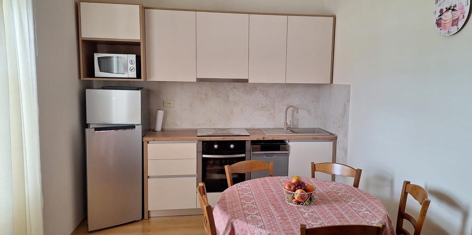 Kitchen or kitchenette, dishwasher, oven, stove