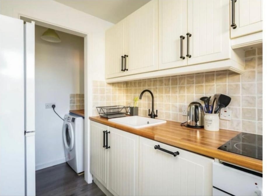 Kitchen or kitchenette, dishwasher, oven, washing machine, dryer
