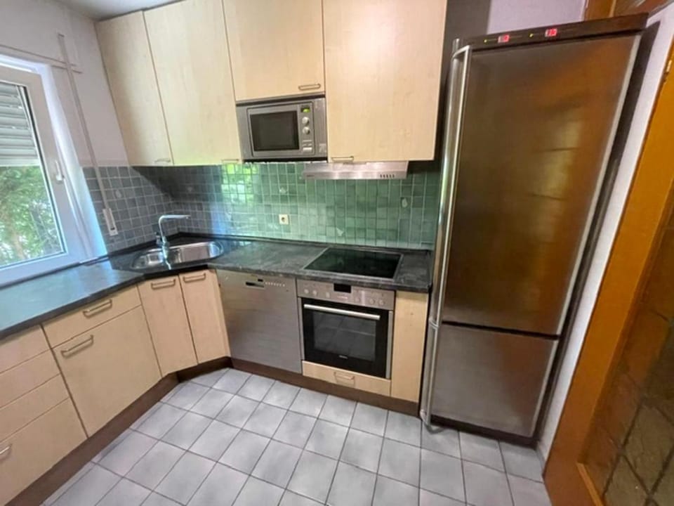 Kitchen or kitchenette, dishwasher, oven, stove