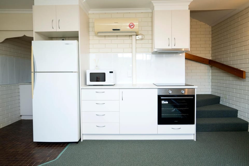 Kitchen or kitchenette, oven, stove