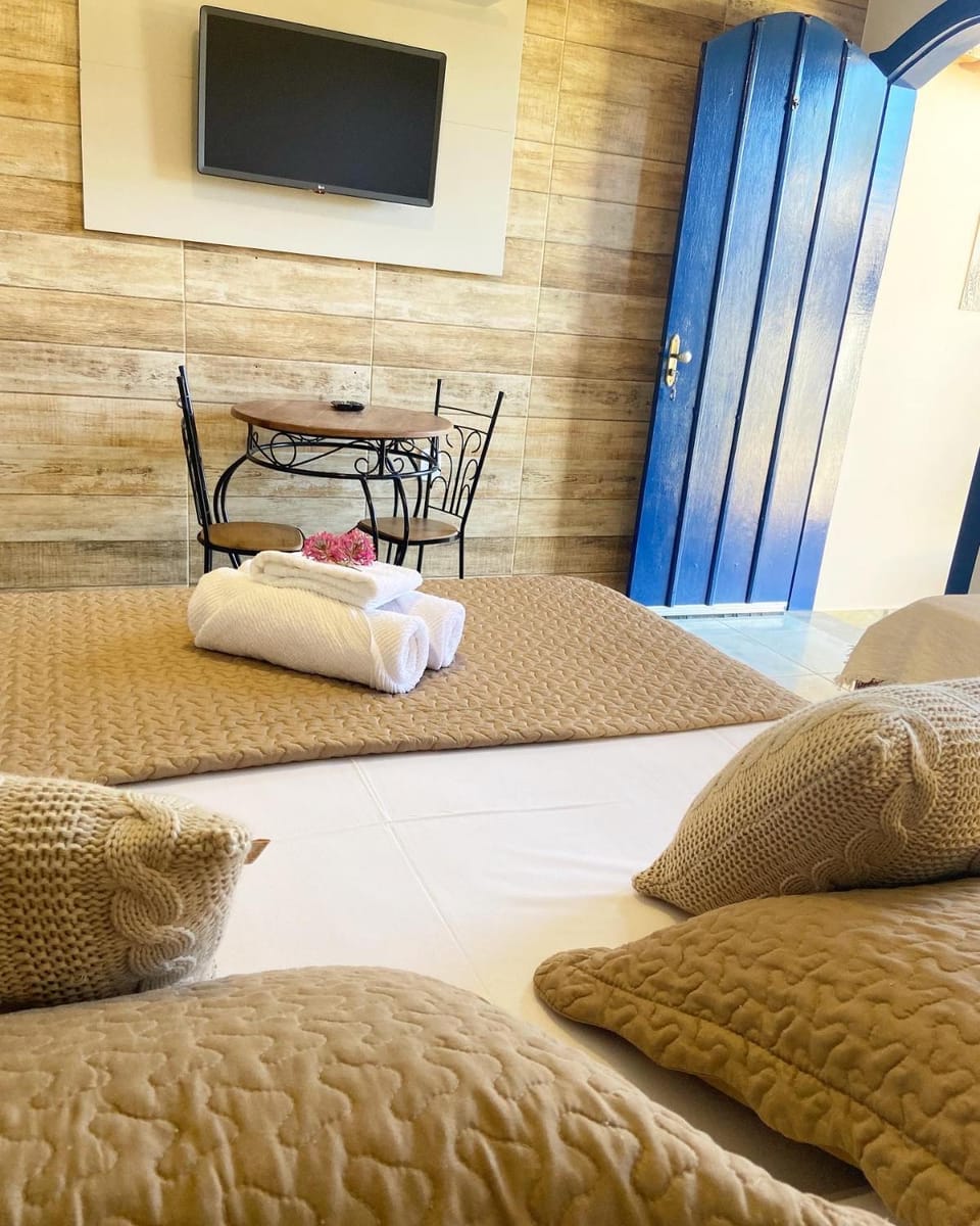 Pousada Luz do Sol, com piscina, quartos amplos e confortáveis no centro de Carrancas Inn in Carrancas