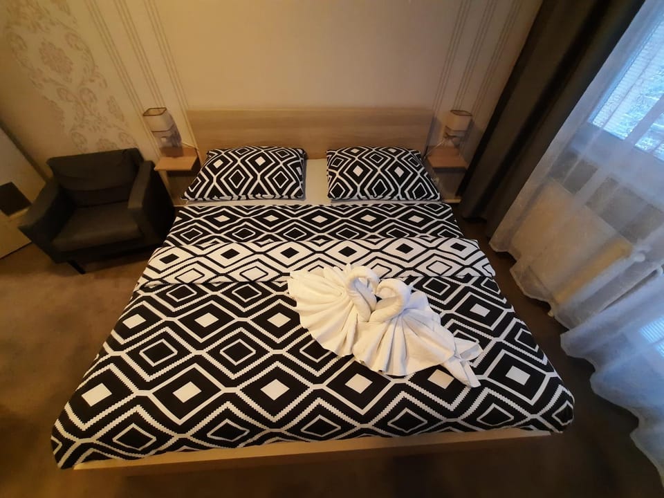 Bed, Photo of the whole room, hair dresser, towels