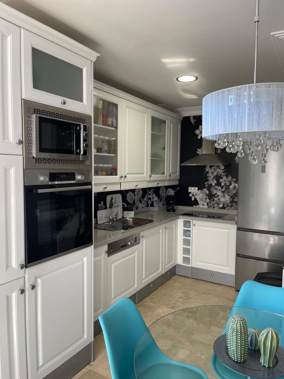 Kitchen or kitchenette, dishwasher, oven, stove