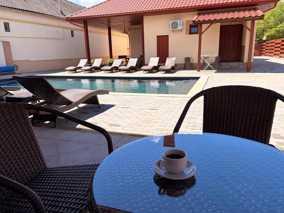 Patio, Seating area, Pool view, Swimming pool, sunbed