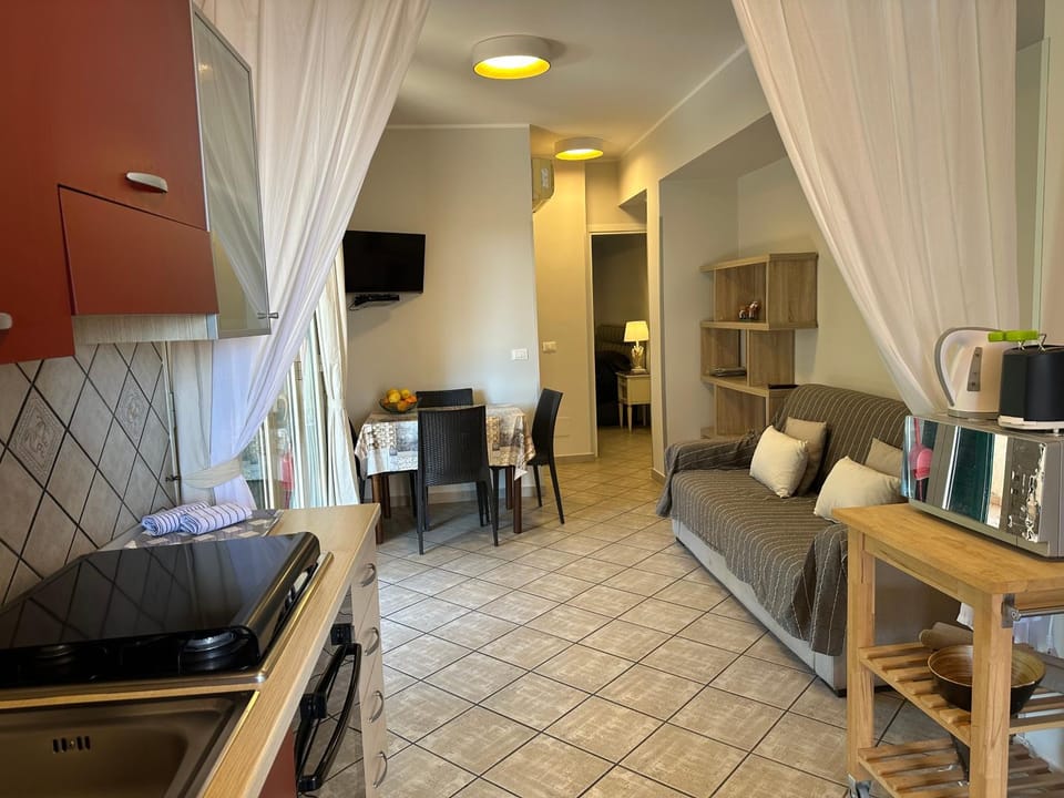 Kitchen or kitchenette, Living room, Seating area, Dining area, oven, stove, toaster