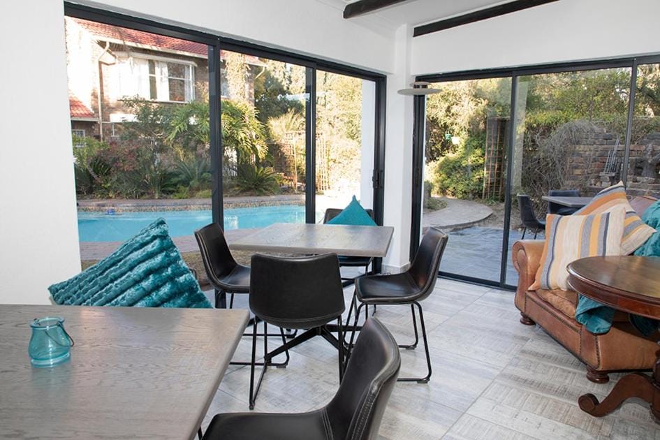 View (from property/room), Living room, Seating area, Dining area, Pool view, Swimming pool, sunbed