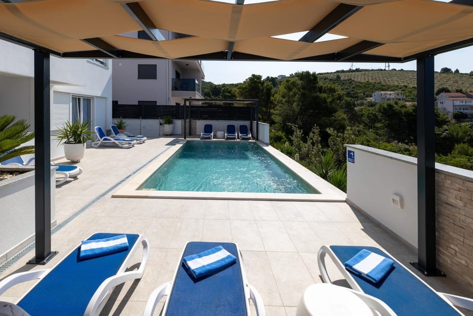 Patio, Day, Natural landscape, Pool view, Swimming pool, sunbed