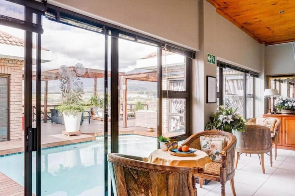 Seating area, Dining area, Pool view