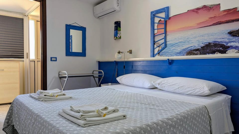 Bed, Photo of the whole room, Bedroom, towels, air conditioner
