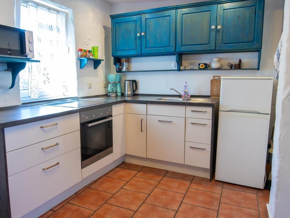 Kitchen or kitchenette, microwave, oven, stove