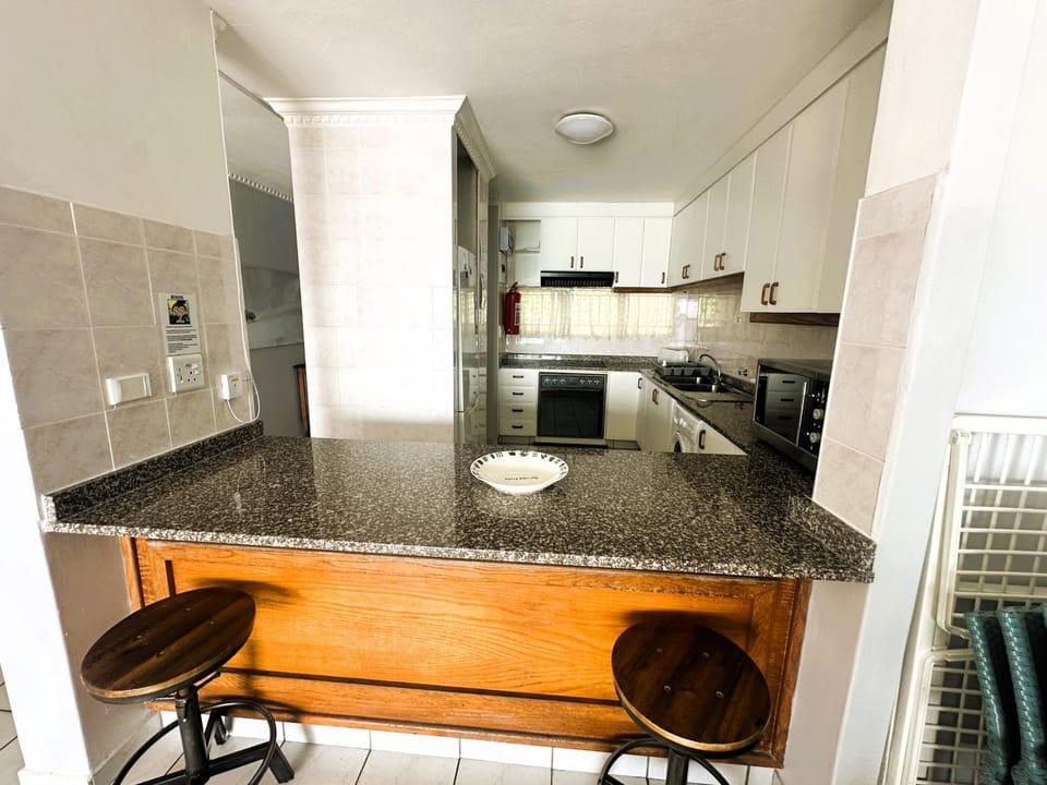 Kitchen or kitchenette, oven, stove