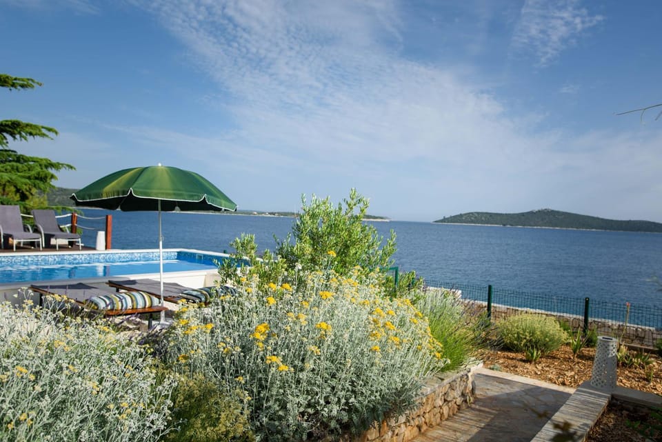 Nearby landmark, Day, Natural landscape, Pool view, Sea view, Swimming pool, sunbed