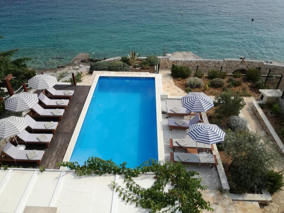 Day, Natural landscape, Beach, Pool view, Sea view, Swimming pool, sunbed