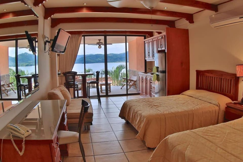 Oceanview Studio Apartment with Community Pool & Views of Flamingo Marina House in Playa Flamingo