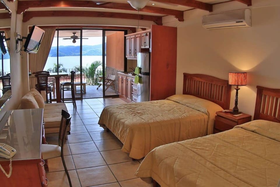 Oceanview Studio Apartment with Community Pool & Views of Flamingo Marina House in Playa Flamingo