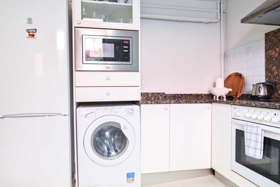Kitchen or kitchenette, microwave, oven, washing machine