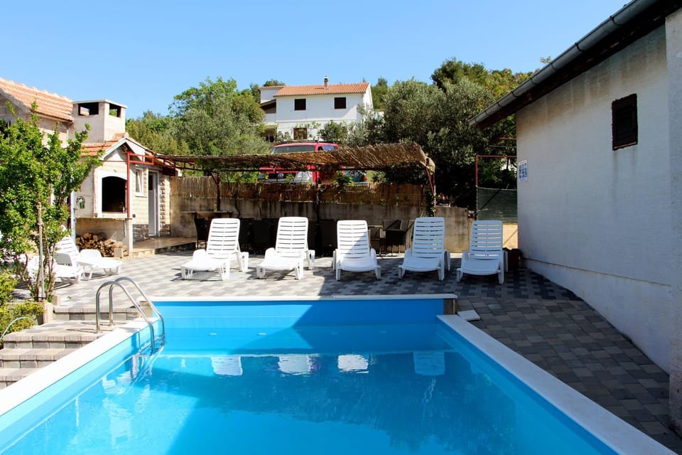 House with outdoor pool in Tisno Apartment in Tisno