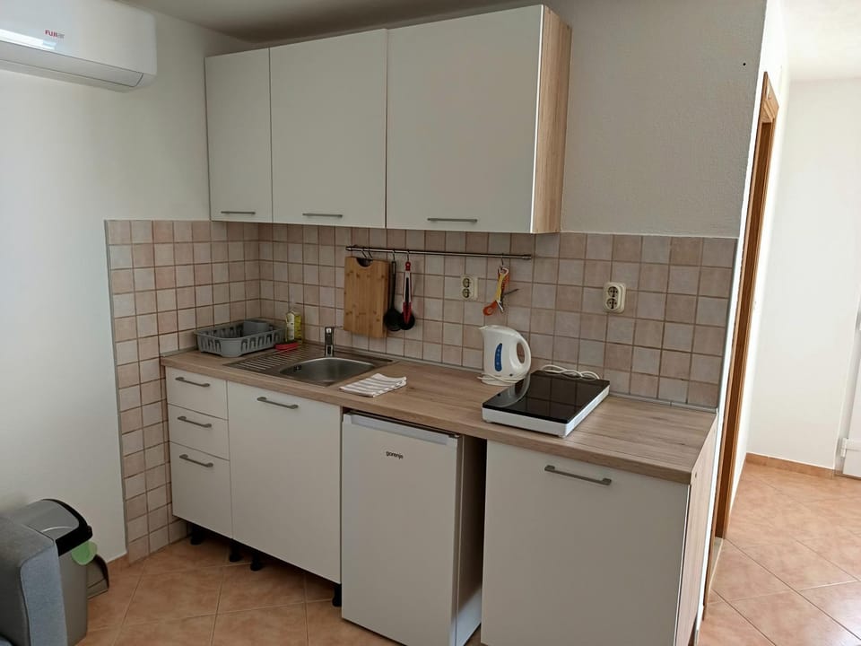 Kitchen or kitchenette, stove