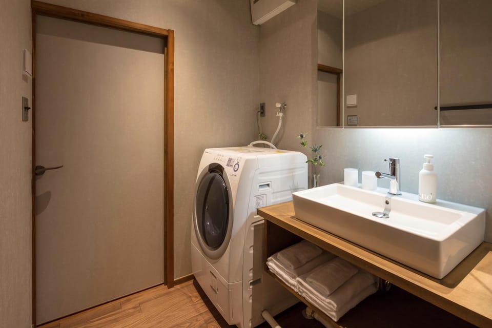 Bathroom, towels, washing machine, dryer