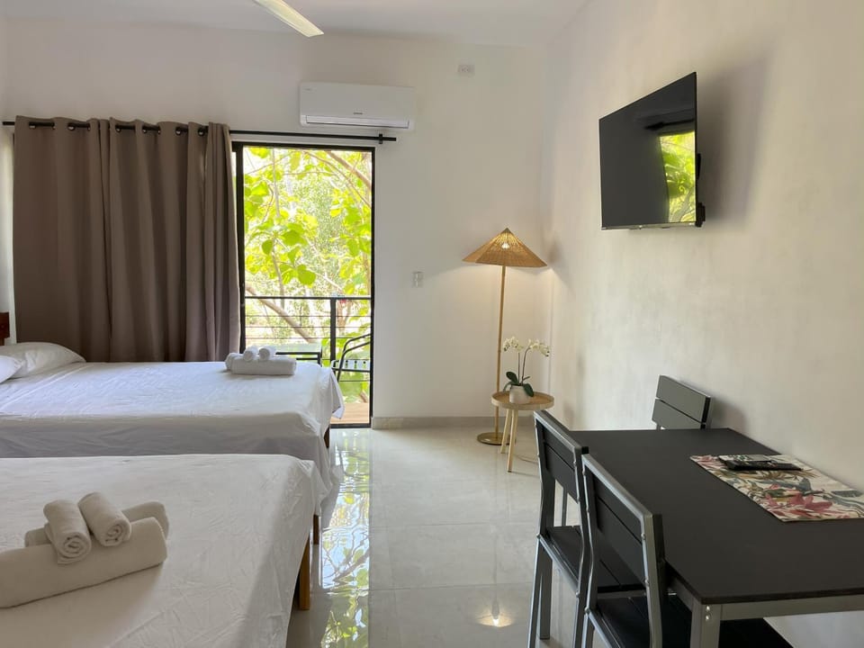 Bed, TV and multimedia, Seating area, Bedroom