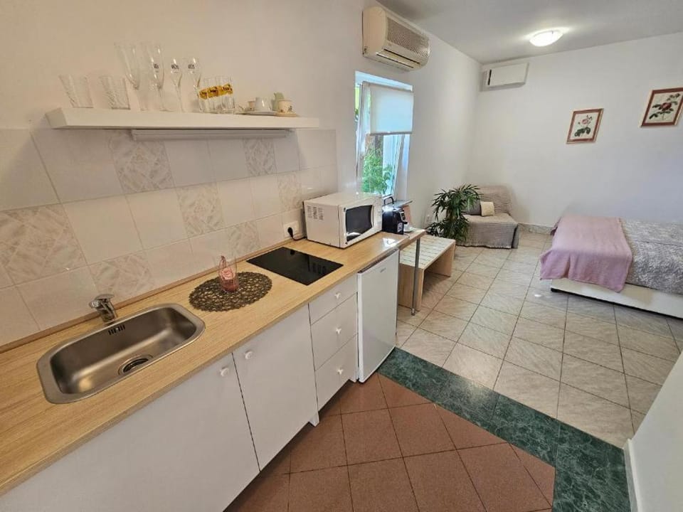 Kitchen or kitchenette, stove, toaster