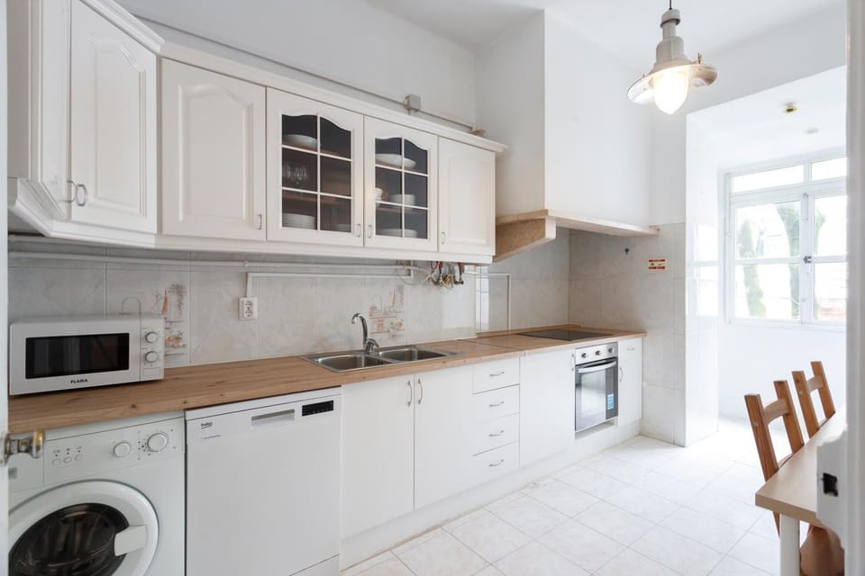 Kitchen or kitchenette, Seating area, furniture, heating, microwave, oven, stove, washing machine, dryer