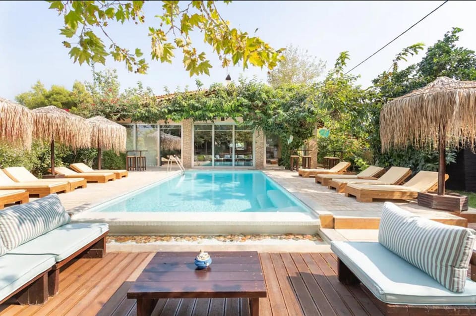 Property building, Seating area, Swimming pool, sunbed