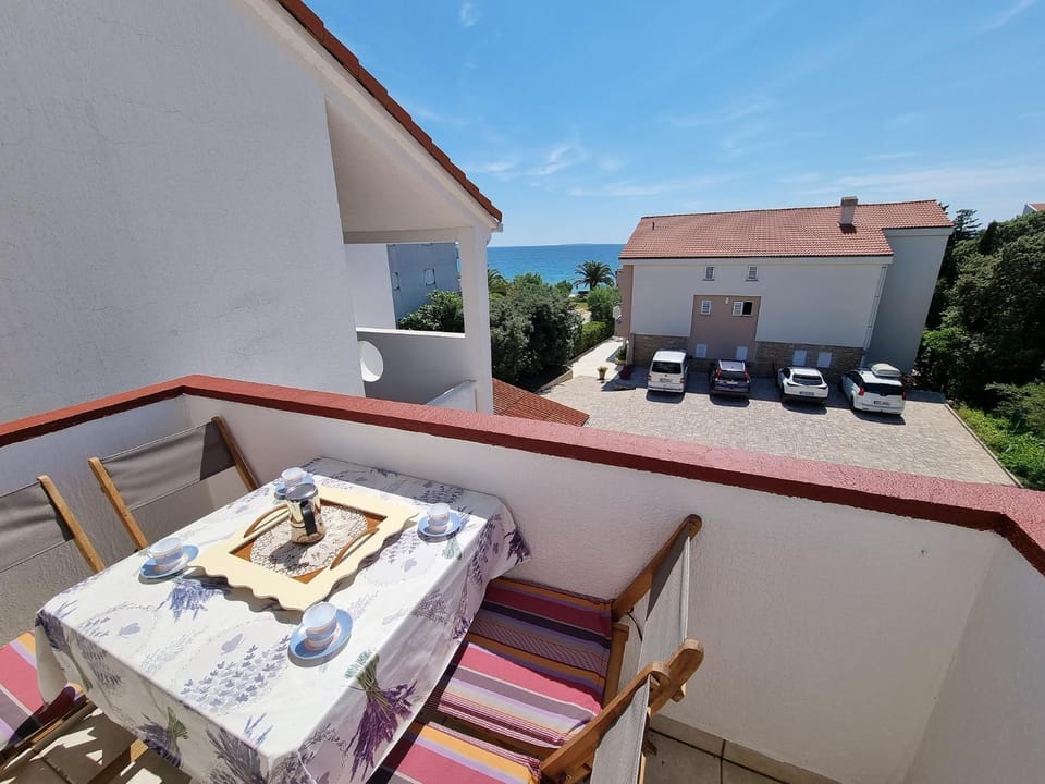 Property building, Patio, Day, Natural landscape, View (from property/room), Balcony/Terrace, Living room, Seating area, Dining area, Sea view, Parking, sunbed