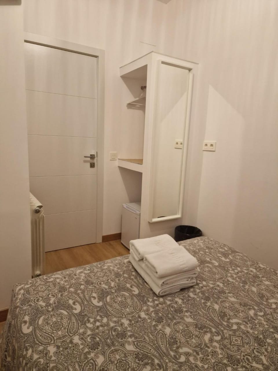Bed, towels, wardrobe