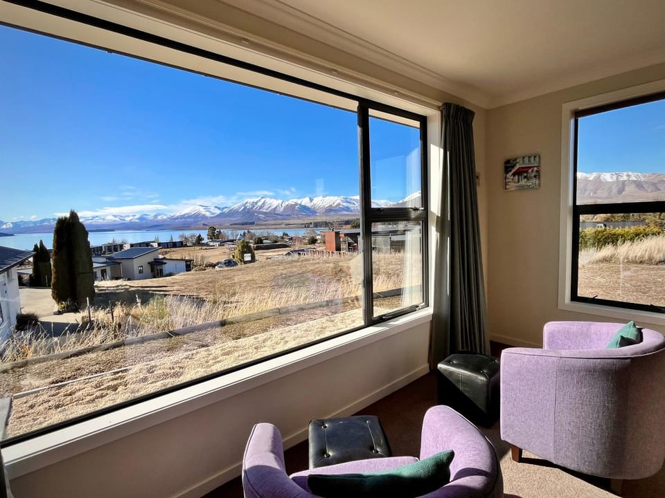Natural landscape, View (from property/room), Living room, Seating area, Lake view, Lake view, Mountain view