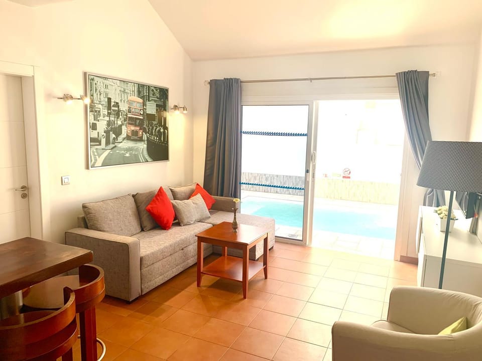 Living room, Seating area, Dining area, Pool view