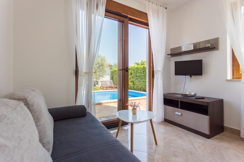 Living room, Seating area, Pool view