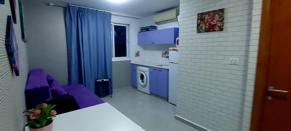 Kitchen or kitchenette, washing machine