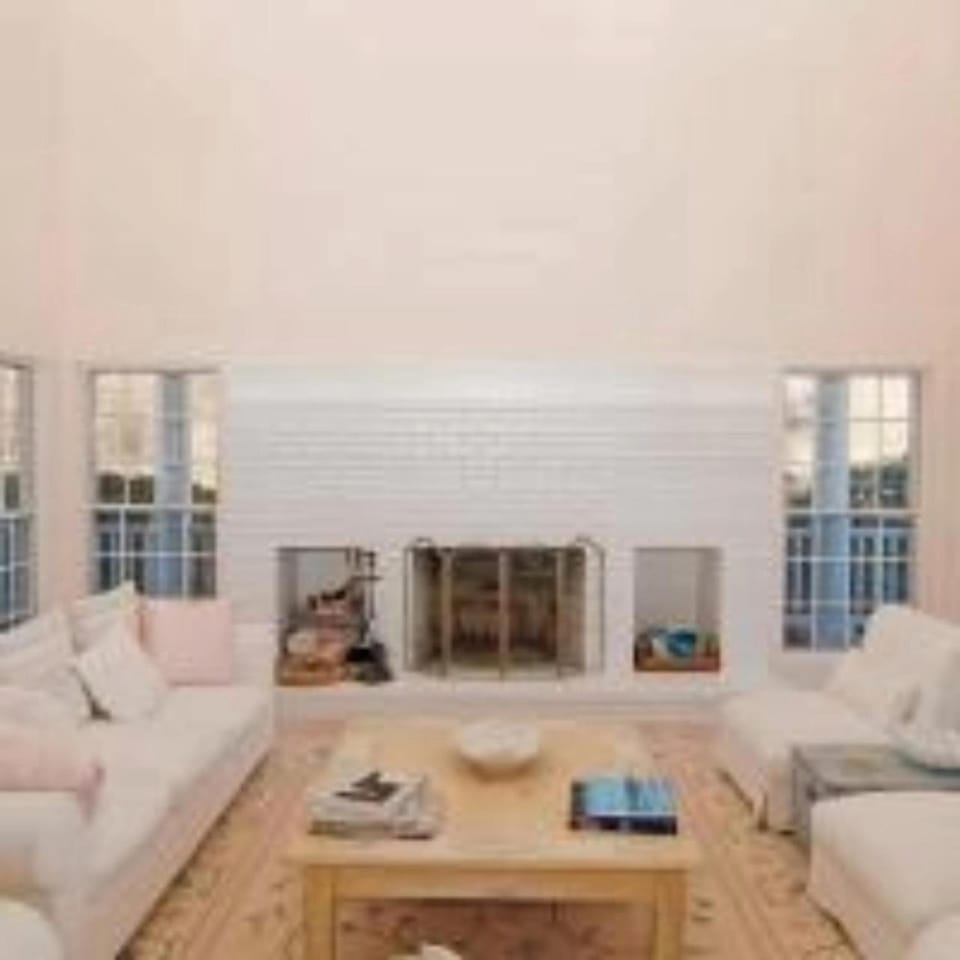 View (from property/room), Living room, Seating area, Garden view, Pool view, fireplace