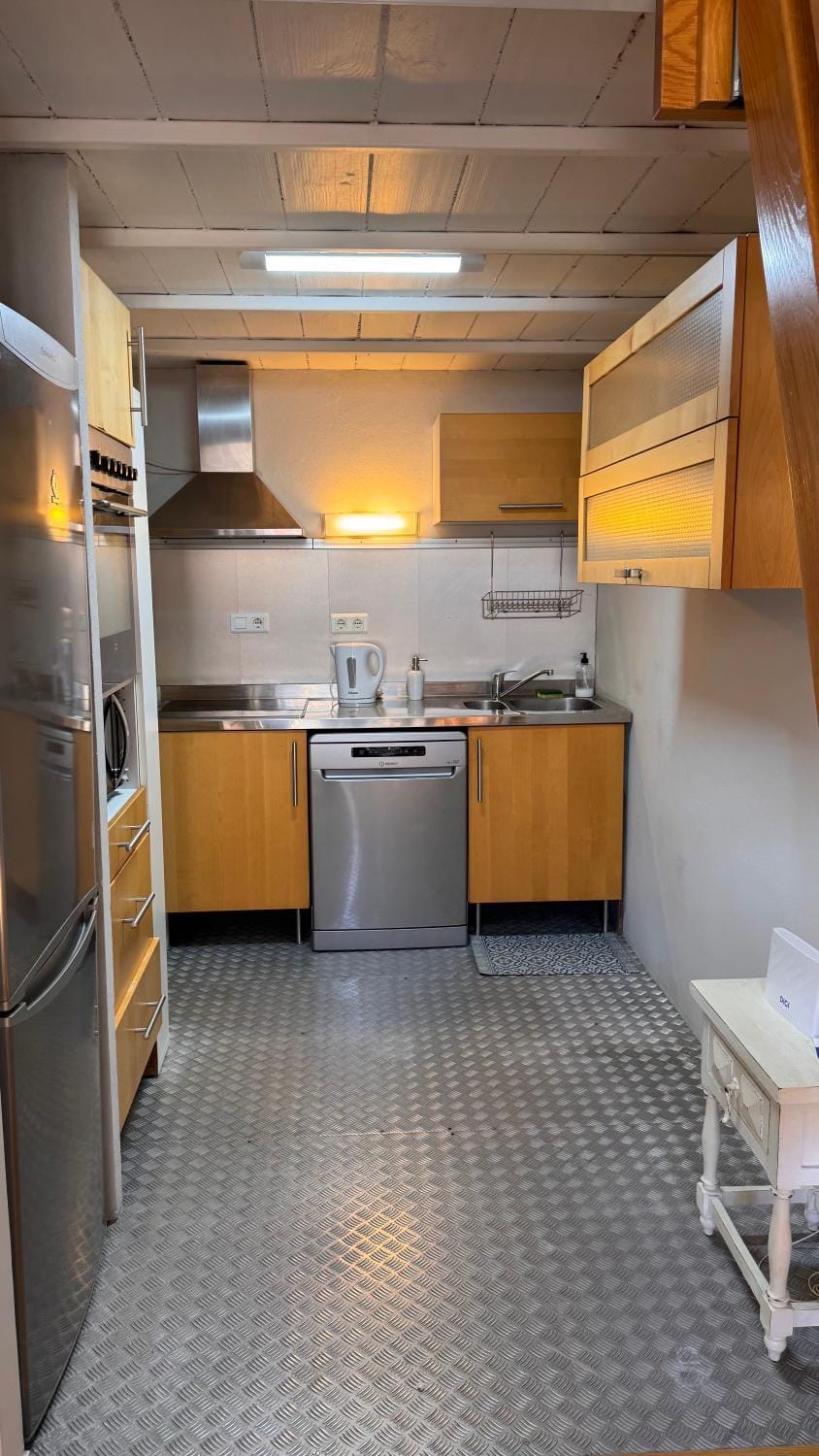 Kitchen or kitchenette, dishwasher, oven, stove