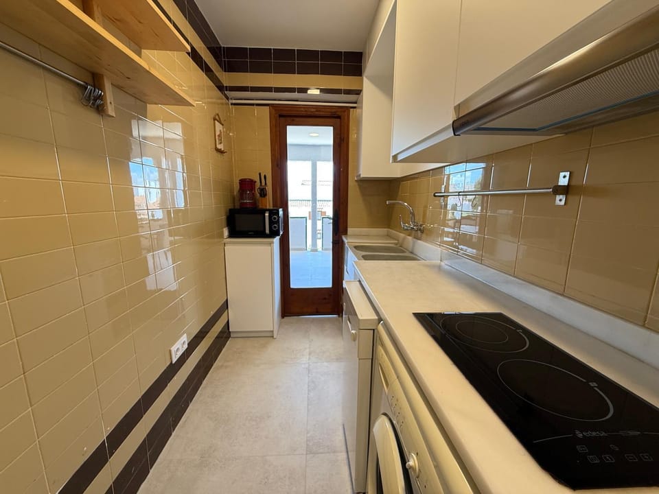Kitchen or kitchenette, dishwasher, microwave, stove, washing machine, kitchen