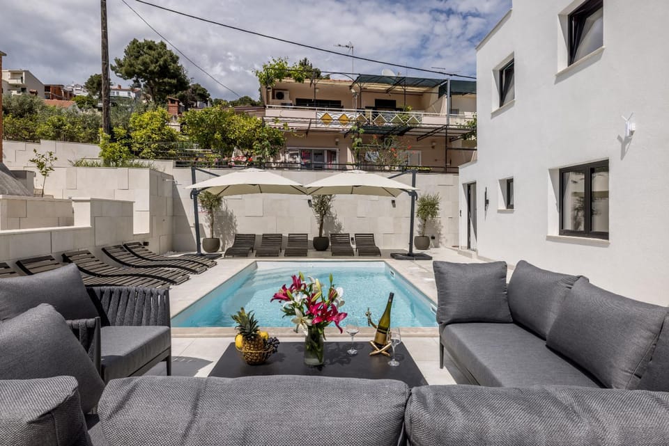 Property building, Patio, Day, View (from property/room), Balcony/Terrace, Living room, Seating area, Pool view, Swimming pool, sunbed